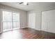 Bedroom with double closets and sliding glass door to balcony at 1867 Myrtle Sw Dr # 26, Atlanta, GA 30311