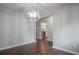 Dining room with dark hardwood floors and a modern light fixture at 1867 Myrtle Sw Dr # 26, Atlanta, GA 30311