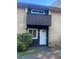 Brick building exterior, featuring a private entrance and landscaping at 1867 Myrtle Sw Dr # 26, Atlanta, GA 30311