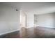 Living room with dark hardwood floors and access to stairs at 1867 Myrtle Sw Dr # 26, Atlanta, GA 30311