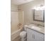 Updated bathroom features granite countertop, white vanity, and updated shower at 1022 Hicksmil Sw Dr, Marietta, GA 30060