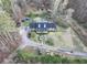 Aerial view of house, driveway, and surrounding trees at 2006 Goode Rd, Conyers, GA 30094