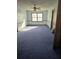 Bright bedroom featuring carpeted floor and ceiling fan at 2006 Goode Rd, Conyers, GA 30094