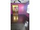 Well-lit bedroom with hardwood floors and bathroom access at 2006 Goode Rd, Conyers, GA 30094