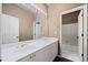 Bathroom with double vanity, mirror, and tiled shower/tub at 2870 The Terraces Way, Dacula, GA 30019