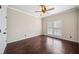 Well-lit bedroom with hardwood floors and plantation shutters at 2870 The Terraces Way, Dacula, GA 30019