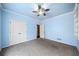 Bedroom with light blue walls, ceiling fan, and gray carpet at 2870 The Terraces Way, Dacula, GA 30019