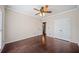 Bright bedroom featuring hardwood floors and ceiling fan at 2870 The Terraces Way, Dacula, GA 30019
