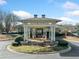 Community clubhouse entrance with columns and landscaping at 2870 The Terraces Way, Dacula, GA 30019