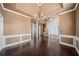 Formal dining room with hardwood floors, wainscoting, and chandelier at 2870 The Terraces Way, Dacula, GA 30019