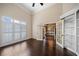 Bright home office features built-in shelving and hardwood floors at 2870 The Terraces Way, Dacula, GA 30019