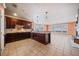 Open kitchen boasts granite counters and breakfast bar at 2870 The Terraces Way, Dacula, GA 30019