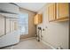 Laundry room with upper cabinets and ample shelving at 2870 The Terraces Way, Dacula, GA 30019