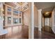 High ceiling living room with hardwood floors, fireplace, and built-in shelves at 2870 The Terraces Way, Dacula, GA 30019