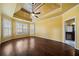 Large main bedroom with tray ceiling, hardwood floors, and abundant natural light at 2870 The Terraces Way, Dacula, GA 30019