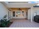 Covered patio with tile floor, ceiling fan, and access to backyard at 2870 The Terraces Way, Dacula, GA 30019