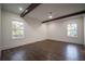 Spacious bedroom with hardwood floors and exposed beams at 2880 Joyce Ave, Decatur, GA 30032