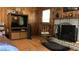 Gathering room with wood paneling, a fireplace, and a rocking chair at 4625 Gaydon Rd, Powder Springs, GA 30127