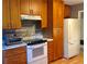 Updated kitchen with wood cabinets, granite countertops, and new appliances at 4625 Gaydon Rd, Powder Springs, GA 30127