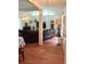 Open living room with hardwood floors, a large TV, and comfortable seating at 4625 Gaydon Rd, Powder Springs, GA 30127