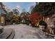 A serene backyard patio with a decorative water fountain and manicured garden at 3685 Paces Ferry Nw Rd, Atlanta, GA 30327