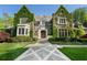 Beautiful stone home with ivy-covered walls and a meticulously landscaped front yard at 3685 Paces Ferry Nw Rd, Atlanta, GA 30327