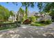 Elegant stone home with lush ivy accents, complemented by manicured landscaping at 3685 Paces Ferry Nw Rd, Atlanta, GA 30327