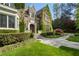 Stone mansion with ivy-covered walls, and stone walkway and professionally landscaped front yard at 3685 Paces Ferry Nw Rd, Atlanta, GA 30327