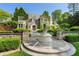 Majestic stone home with verdant ivy, complemented by a decorative water feature at 3685 Paces Ferry Nw Rd, Atlanta, GA 30327
