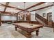 A finished basement game room features a pool table, bar, and staircase at 3685 Paces Ferry Nw Rd, Atlanta, GA 30327