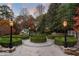 Backyard formal garden with trimmed hedges, walking path, and classic lampposts at 3685 Paces Ferry Nw Rd, Atlanta, GA 30327
