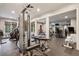Spacious home gym with state-of-the-art exercise equipment and rubber flooring at 3685 Paces Ferry Nw Rd, Atlanta, GA 30327