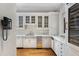 Bright kitchen featuring marble countertops, stainless steel appliances, and white cabinetry at 3685 Paces Ferry Nw Rd, Atlanta, GA 30327