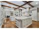 Bright, open kitchen featuring hardwood floors, large islands, and modern design at 3685 Paces Ferry Nw Rd, Atlanta, GA 30327