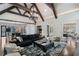 Spacious open-concept living room with hardwood floors, fireplace, and large windows at 3685 Paces Ferry Nw Rd, Atlanta, GA 30327