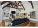 Bright living room featuring vaulted ceilings, hardwood floors, fireplace, and staircase at 3685 Paces Ferry Nw Rd, Atlanta, GA 30327