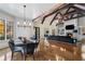Open concept living room and dining area with hardwood floors and vaulted ceilings at 3685 Paces Ferry Nw Rd, Atlanta, GA 30327