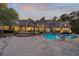 Expansive backyard featuring a shimmering pool, inviting lounge areas, and elegant landscaping, ideal for outdoor entertainment at 3685 Paces Ferry Nw Rd, Atlanta, GA 30327