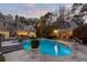 Stunning pool area featuring a sparkling pool, manicured landscaping, and elegant stone architecture for luxurious outdoor living at 3685 Paces Ferry Nw Rd, Atlanta, GA 30327