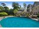 Gorgeous backyard with a pristine pool, a relaxing spa, and manicured landscaping, creating a serene retreat at 3685 Paces Ferry Nw Rd, Atlanta, GA 30327