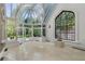 Sunroom with domed glass roof, tile floors, and large windows at 3685 Paces Ferry Nw Rd, Atlanta, GA 30327