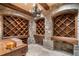 A rustic wine cellar with stone walls and wooden shelving provides ample wine storage at 3685 Paces Ferry Nw Rd, Atlanta, GA 30327