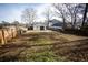 Large backyard with a view of the house and wooden fence at 1401 Boulevard Se, Atlanta, GA 30315