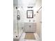 Clean bathroom with gray vanity, marble shower, and modern fixtures at 1401 Boulevard Se, Atlanta, GA 30315