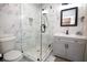 Modern bathroom with a frameless shower and gray vanity at 1401 Boulevard Se, Atlanta, GA 30315
