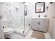 Clean bathroom with gray vanity, marble shower, and modern fixtures at 1401 Boulevard Se, Atlanta, GA 30315
