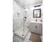Updated bathroom with gray vanity, marble shower, and modern fixtures at 1401 Boulevard Se, Atlanta, GA 30315