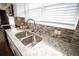 Modern kitchen with granite countertops and stainless steel sink at 1401 Boulevard Se, Atlanta, GA 30315