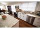 Open concept kitchen with island, granite counters, and stainless steel appliances at 1401 Boulevard Se, Atlanta, GA 30315