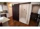 Convenient laundry area with barn door and tiled floor at 1401 Boulevard Se, Atlanta, GA 30315